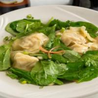 Wonton Soup · Wonton soup with Thai traits in clear chicken broth with fresh spinach and chopped carrot an...