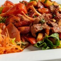 Fiery Grilled Beef Salad · Char-grilled strips of lean beef tossed with fresh vegetables, Phuket chili paste, balanced ...