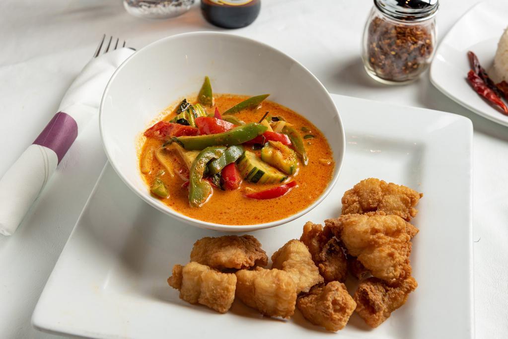 Spicy Catfish · Catfish steaks delicately fried blanketed fiery red chili sauce, bell pepper, eggplant, zucchini, and Thai basil.
