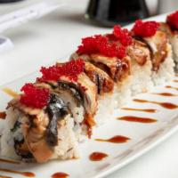 Dragon Roll · Smoked salmon and cream cheese, topped with eel and tobiko.