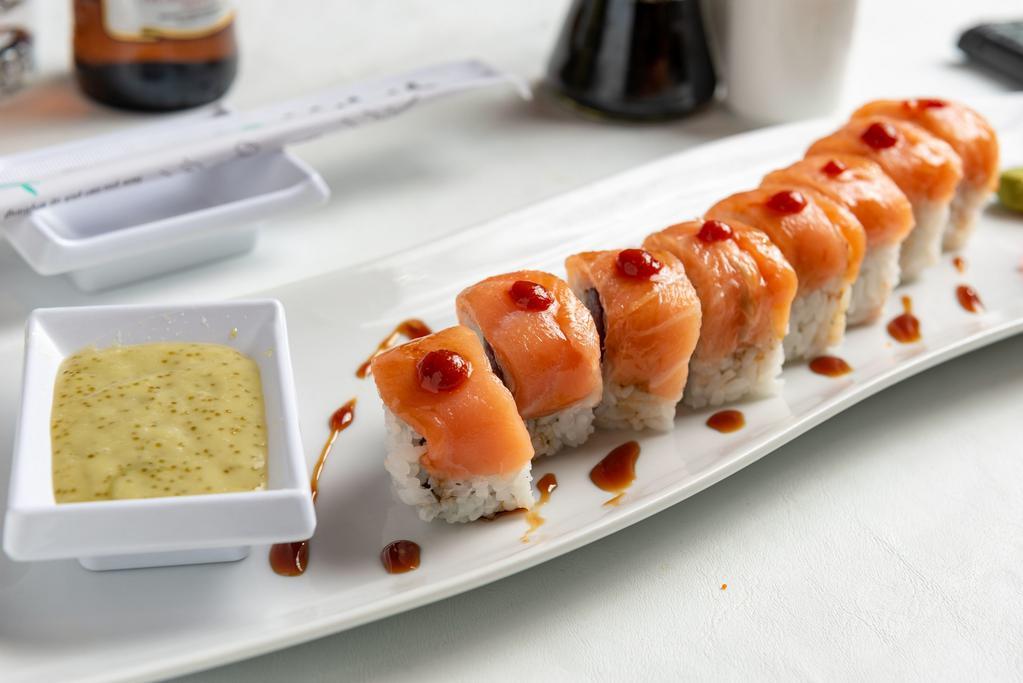 Wasabi Maki Roll · Tuna, yellowtail, crab stick and cucumber topped with salmon served with wasabi sauce.