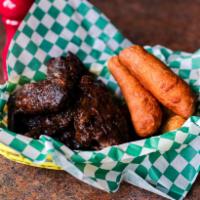 Wings and Festivals · Marinated jerk wings served with sweet fried dumplings.