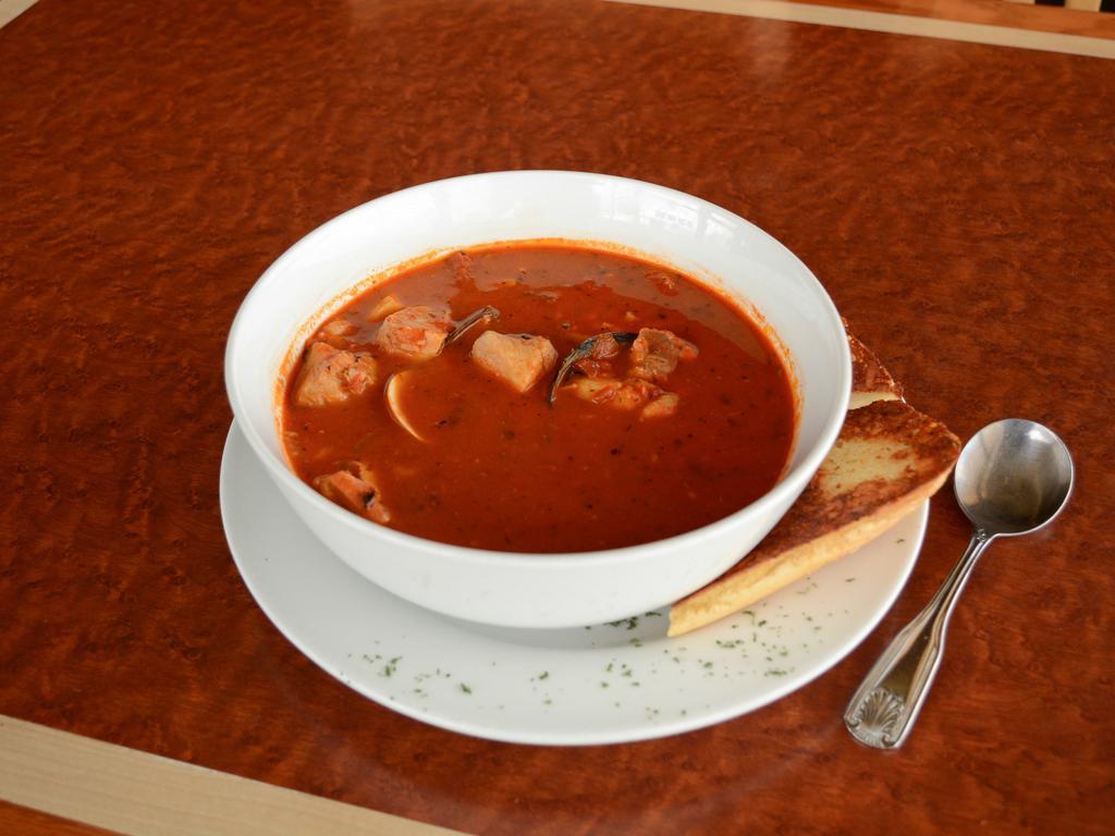 Cioppino · Mussels, clams, salmon, whitesh and shrimp in a rich tomato and herb broth.