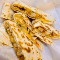Quesadilla · Flour tortilla, choice of meat, jack and cheddar cheese, sour cream and guacamole on the sid...