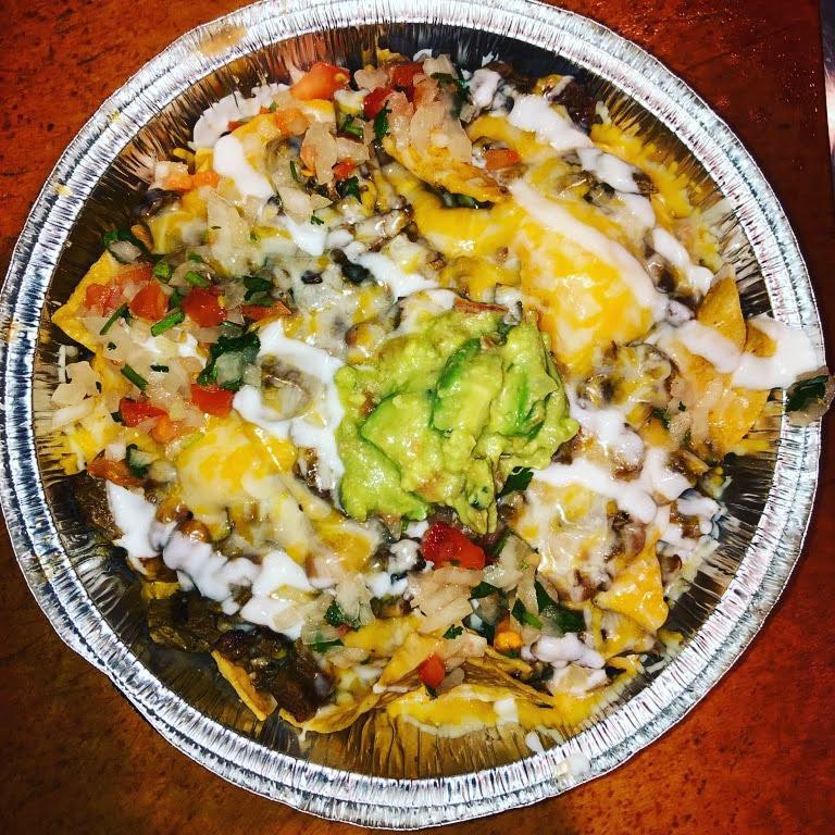 Nachos · Corn tortilla chips, choice of meat, beans, jack and cheddar cheese, sour cream, pico de gallo, guacamole and jalapenos.