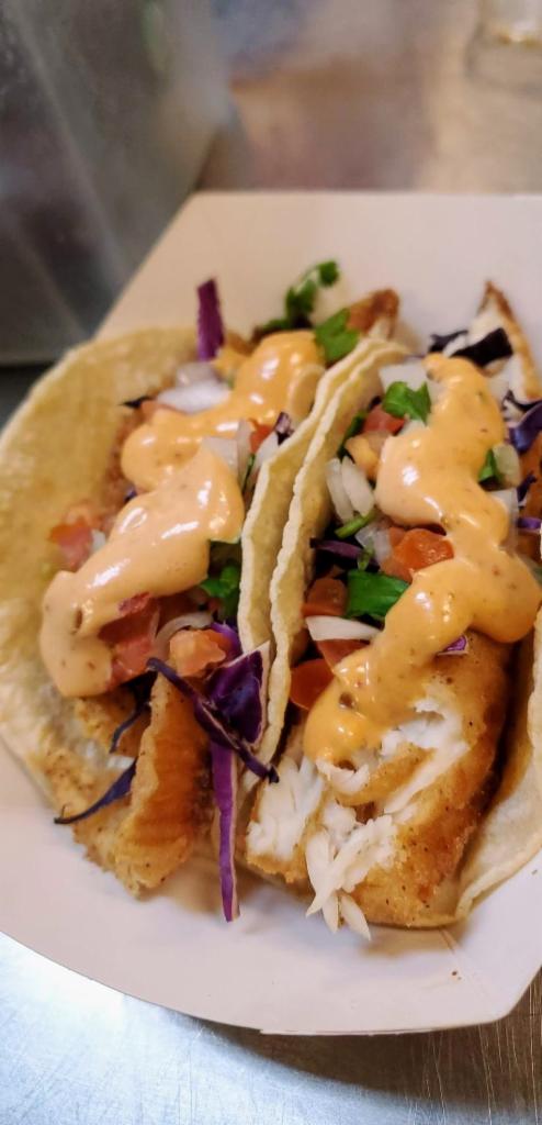 Fish Taco Plate · 3 corn tortilla tacos, red cabbage, chipotle sauce and pico de gallo. Served with Rice and Pinto Beans with cheese.