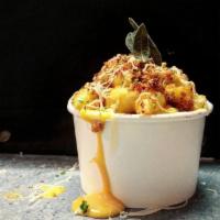 Mac N Queso (d) - Large (32 oz) · Cheddar, Monterrey & Jack house made cheese sauce with aji amarillo and butternut squash...