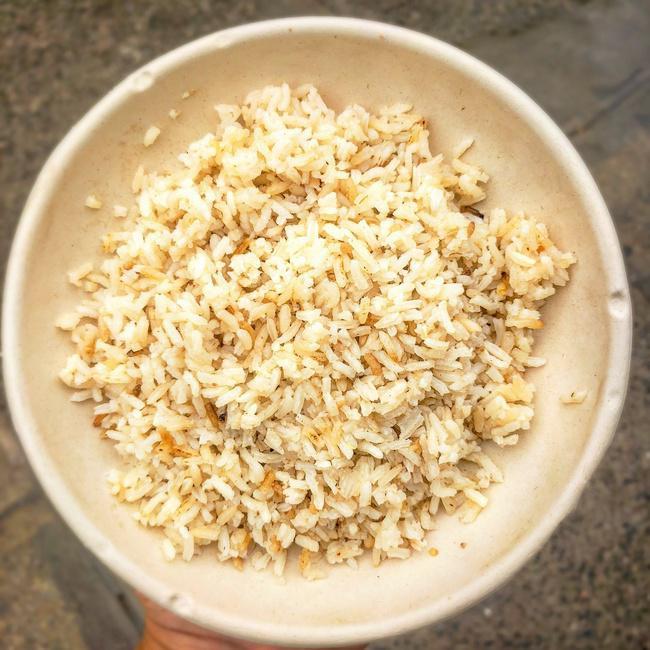 Bolivian Toasted Garlic Rice (d) - Small (12oz) · Bolivian style toasted rice is fragrant white rice lightly toasted to bring out its nuttiness and sautéed in garlic and allspice. Perfect for stir frys or accompanying chicken, beef or fish.
