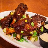 Flying Pork Wings · 4 pieces. Buffalo, barbecue or teriyaki style. Served with ranch or bleu cheese dipping sauce.
