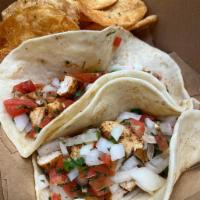 Chicken Fajita Tacos · Topped with house queso and house pico de gallo.

Served with house-made chips.