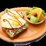 Avocado Toast · Avocado lovers rejoice! Our breakfast spin on a delicious new trend; wheat toast covered in mashed avocados, diced tomatoes, feta cheese, and two sunny-side-up eggs. Sprinkled with our signature spices and drizzled in sriracha sauce. Served with a scrambler side.