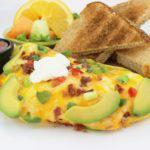 Awesome Avocado Omelette · Stuffed with ripe avocado, lean bacon, bell pepper, a blend of Monterey Jack and cheddar che...