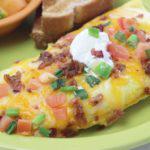 Ultimate Omelette · This one's got the works! Stuffed with sausage, ham, bacon, bell peppers, celery, zucchini, ...