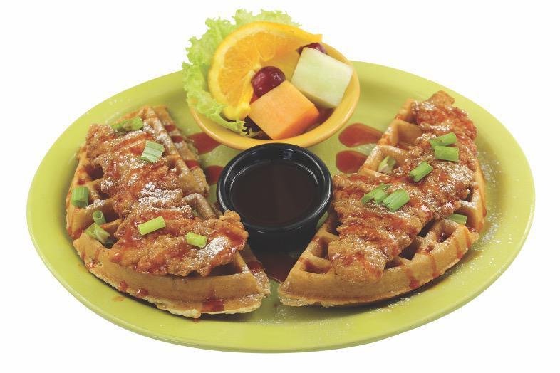 Chicken and Waffles · Breaded chicken tenders on a Belgian waffle, sprinkled with powdered sugar and chives drizzled with our signature zesty syrup. Served with a cup of fresh fruit.