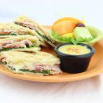 Turkey Flatbread  · Natural honey smoked turkey, spinach, tomatoes and Swiss cheese pressed into a one-of-a-kind...