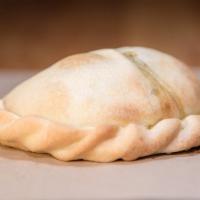 Spinach Empanada · Garlic, Onions, Spinach, Cream, Mozzarella and Parmesan.
