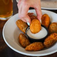 Jalapeno Poppers · Lightly breaded and fried jalapeno peppers, stuffed with cream cheese. 