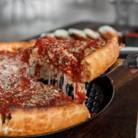 Chicago Deep Dish Pizza · Pan-cooked, buttery crust that is smothered with cheese, and chunky tomato sauce, then baked...