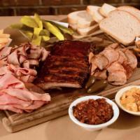 Meat Platter Specialty · Serves 4. 1/2 lb beef, 1/2 lb ham, 1/2 slab, and sliced sausage. Choice of 4 classic sides, ...