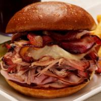 Hog Wild Sandwich · Juicy, tender ham and our famous pulled pork topped with melted provolone cheese and two str...