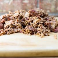 Pulled pork · Tender and juicy, hickory-smoked low and slow overnight.