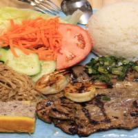 71 - Vietnam Special Broken Rice · Pork chop, shrimp, quiche and shredded pork. Broken rice, lettuce, cucumber, tomatoes, pickl...
