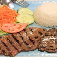 78 - Grilled Steak Broken Rice · Grilled ribeye steak. Broken rice, lettuce, cucumber, tomatoes, pickled carrots and sauteed ...