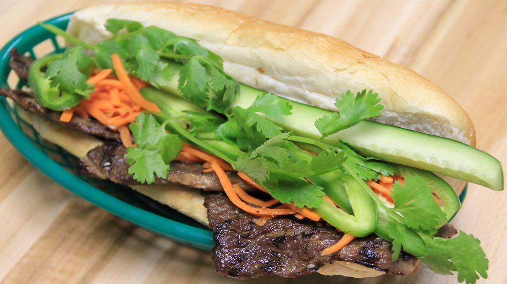 127 - Grilled Sesame Beef Hoagie · Grilled sesame beef, butter, sauteed scallions, house sauce, pickled carrots, cucumber, jalapeno peppers and cilantro.