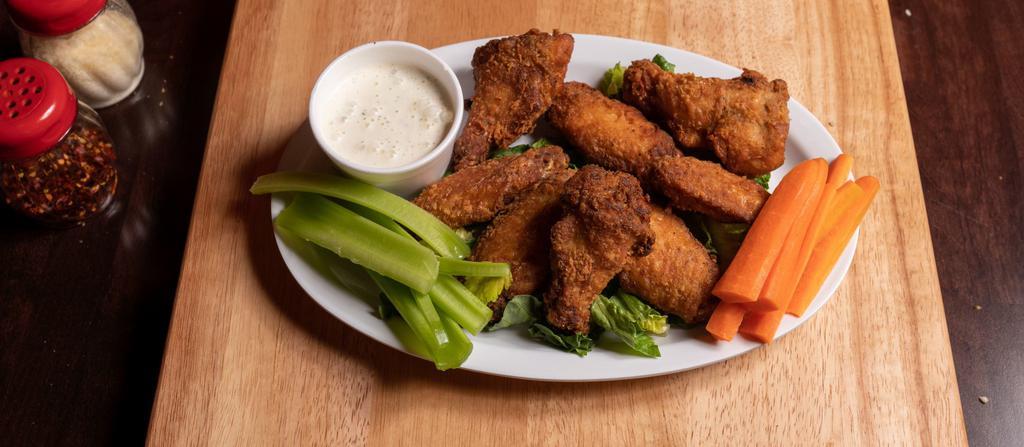 Jumbo Chicken Wings · Fresh, never frozen and made in house! We marinate and slow cook our wings for juicy tenderness, then finish them off in the fryer for a perfect crunch. Served with celery sticks and ranch or blue cheese. Extra dressing for an additional charge.