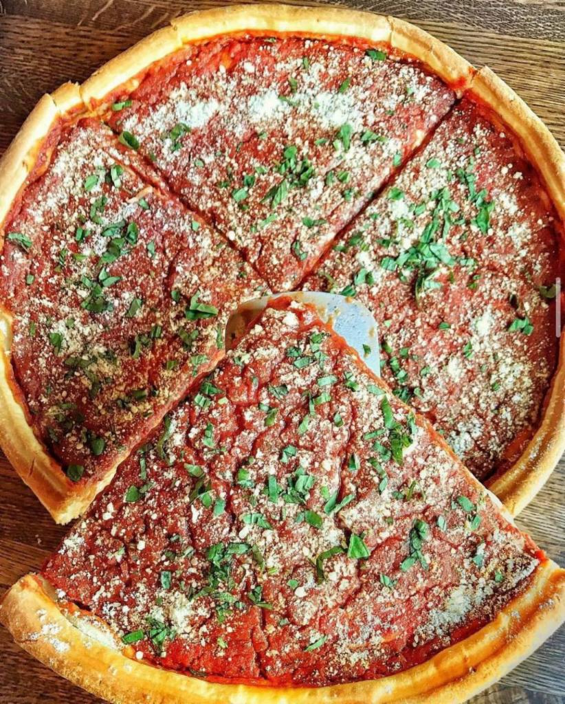 Deep Dish Stuffed Cheese Pizza · Traditional Chicago Deep Dish, stuffed with loads of mozzarella and ingredeints, topped with an extra layer of pizza dough and our fresh signature pizza sauce, then baked like a pie.