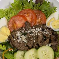 Steak Salad · House Salad Topped with Tender strips of steak, sliced tomatoes, cucumbers, Queso fresco and...