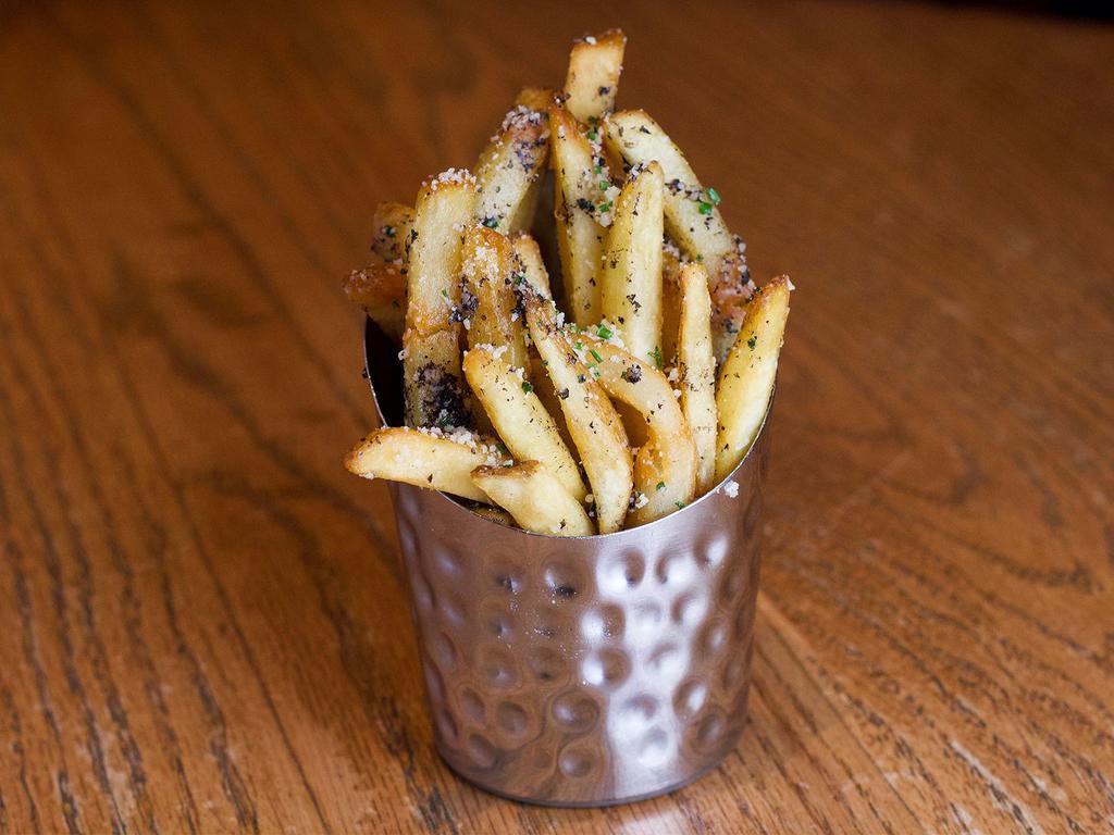 Truffle Fries · Thicker than our standard fries, golden brown, tossed with black truffles, olive oil and salt, and topped with Parmesan cheese.