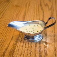 Lemon Garlic Butter · A sauce of roasted garlic, lemon & melted butter.
