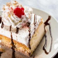 Tres Leches Cake · Sponge cake soaked in a sweet mixture of 3 different types of milk.