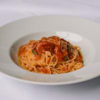 Spaghettini · Fresh basil, San Marzano tomatoes.