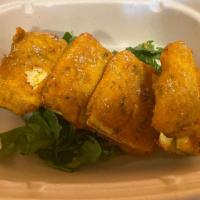 Paneer Pakoras · Cheese chunks dipped in batter and fried.