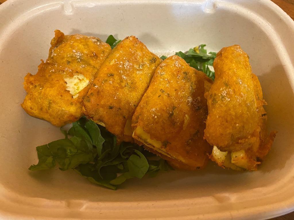 Paneer Pakoras · Cheese chunks dipped in batter and fried.