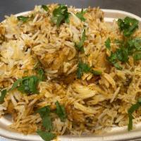 Chicken  Biryani · Cooked in with rice using various spices, comes with yogurt sauce. Bone-in chicken