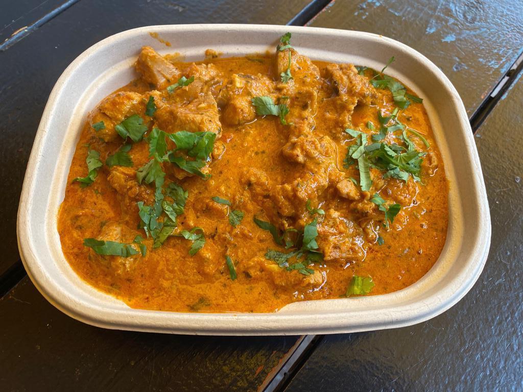 PUNJABI CHICKEN  · INTRUDUCING - BONE IN CHICKEN MARINATED IN HUNG YOGURT AND MUSTARD OIL OVERNITE COOKED IN TOMATO CREAM WITH RED CHILLIES TO GIVE YOU THE REAL AUTHENTIC TASTE. SERVED WITH RICE AND CHICKPEAS