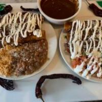 Chicken Flautas · Rolled with cheese in a flour tortilla, fried, and served with salad (pico de gallo, sour cr...