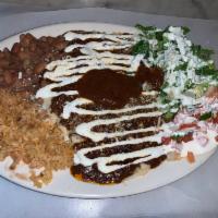 Chicken Mole Enchiladas · Served with rice, Beans, Cheese, Chicken mole, lettuce, pico de Gallo, sour cream and mole s...