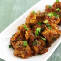 Mushroom Manchurian · Vegan & Vegetarian- Fried mushroom sautéed in manchurian sauce