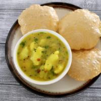 Puri Masala (2 Pcs) · Vegan & Vegetarian- Deep fried wheat bread served with potato curry