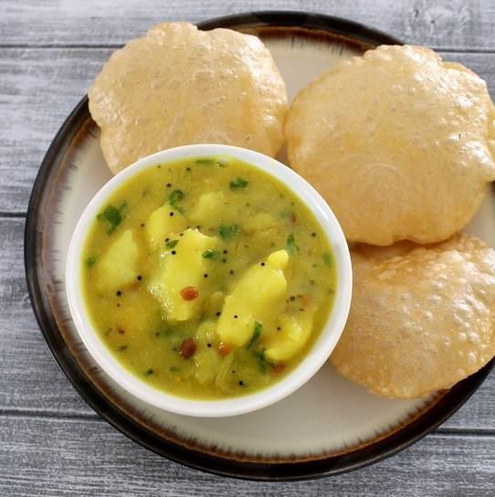 Puri Masala (2 Pcs) · Vegan & Vegetarian- Deep fried wheat bread served with potato curry