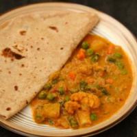 Chapathi Kurma (2 Pcs) · Vegetarian- Round flatbread made with whole-wheat served with mix vegetable curry.