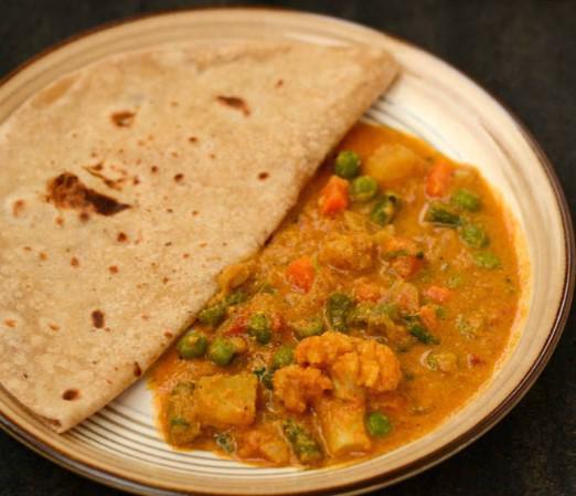 Chapathi Kurma (2 Pcs) · Vegetarian- Round flatbread made with whole-wheat served with mix vegetable curry.
