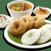Idli Vada Combo (2 Idlis, 1 Vada) · Vegan & Vegetarian-Steamed rice cakes and fried lentil donuts served with sambar and chutneys.
