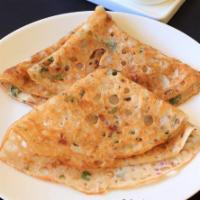 Ravva Dosa · Vegan & Vegetarian- Dosa, thin semolina crepes served with sambar and chutneys