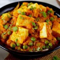 Matar Paneer Curry · Vegetarian- Cottage cheese cubes cooked with green peas.