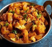 Aloo Gobi · Vegan & Vegetarian- Fried potatoes and cauliflower flavored with traditional spices